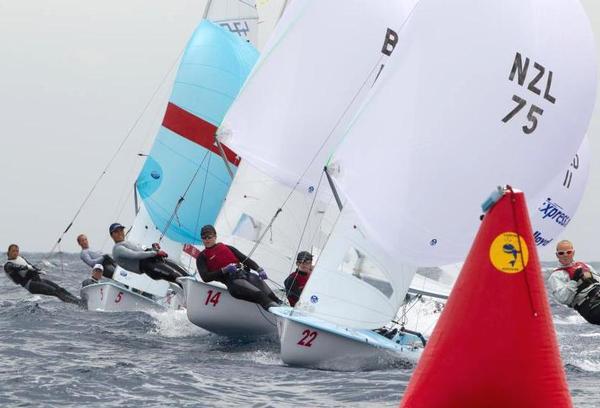 Jo Aleh and Polly Powrie leading into a course mark kept pace and pressure on the lead boats.  